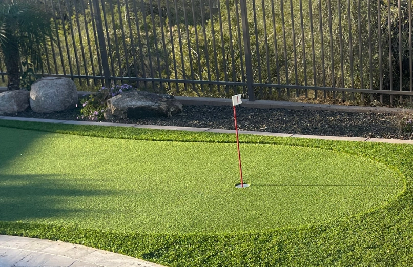 Synthetic grass installation creating a modern outdoor living space in Dallas